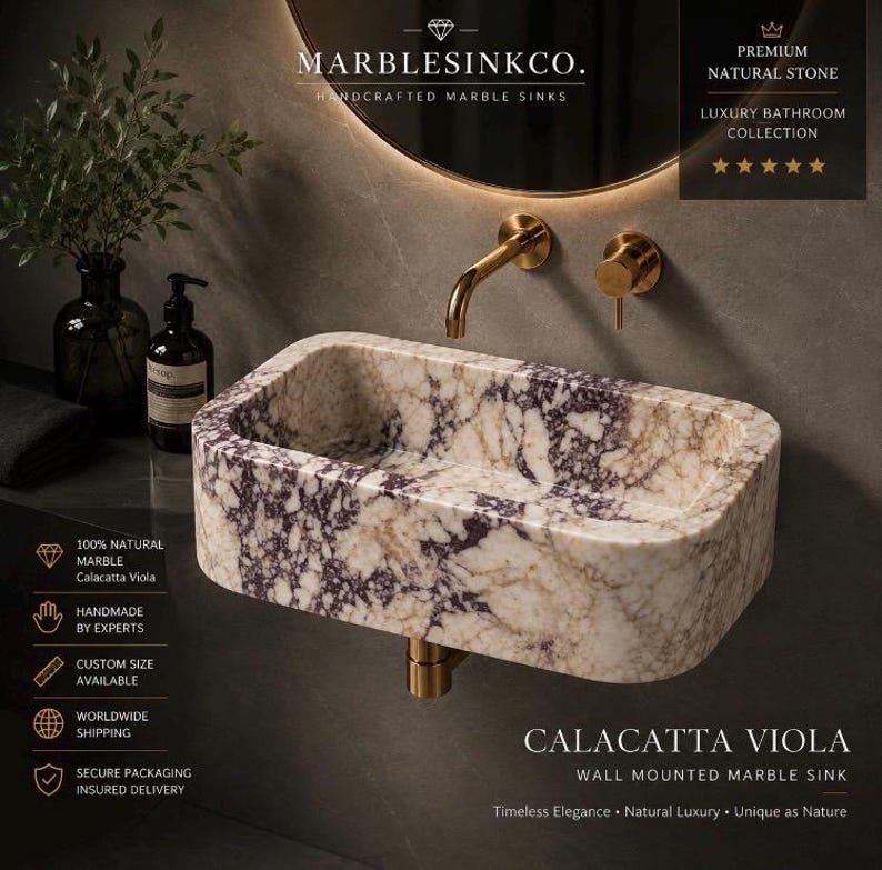Luxury handcrafted Calacatta Viola marble floating wall mounted bathroom sink with fluted front in a premium designer bathroom.