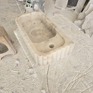 Handcrafted marble sink, Carrara marble basin, custom stone washbasin for bathroom, wall mounted and countertop vessel sink, natural stone vanity bowl, luxury bathroom design, Italian marble handmade sink, unique veined stone, elegant bathroom interior, artisanal stonework, real marble powder room sink, modern minimalist bathroom decor, durable and stylish marble sink, bathroom remodel ideas, hotel and yacht sink design