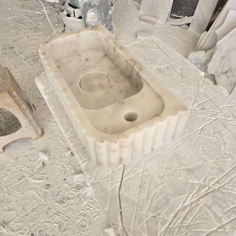 Handcrafted marble sink, Carrara marble basin, custom stone washbasin for bathroom, wall mounted and countertop vessel sink, natural stone vanity bowl, luxury bathroom design, Italian marble handmade sink, unique veined stone, elegant bathroom interior, artisanal stonework, real marble powder room sink, modern minimalist bathroom decor, durable and stylish marble sink, bathroom remodel ideas, hotel and yacht sink design