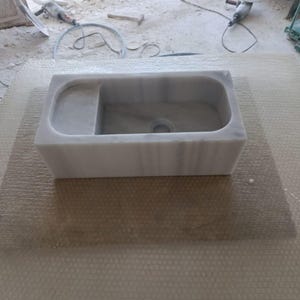 compact-wall-mounted-marble-sink.jpg