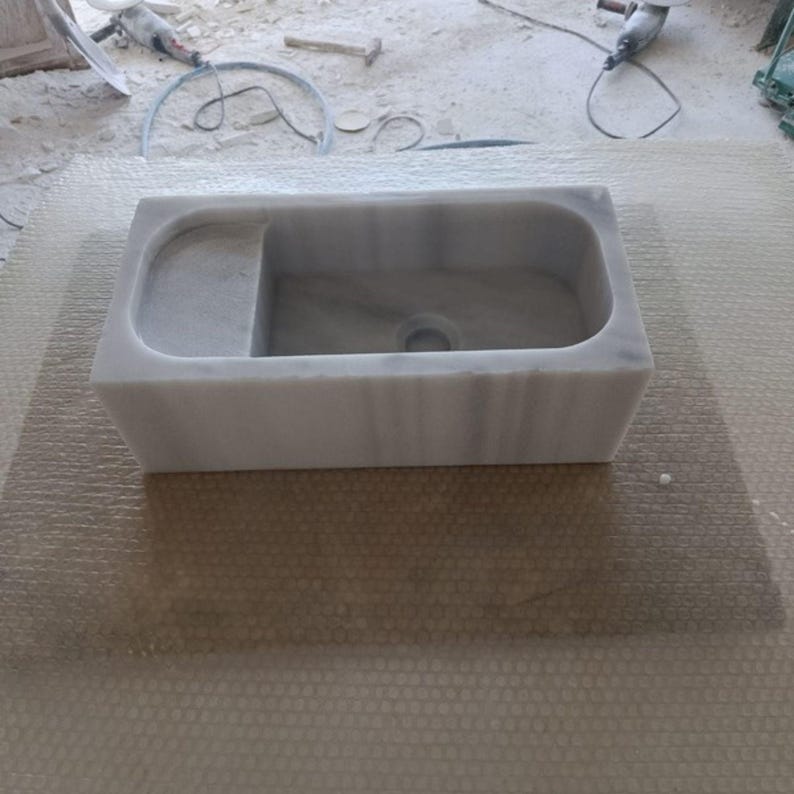 compact-wall-mounted-marble-sink.jpg