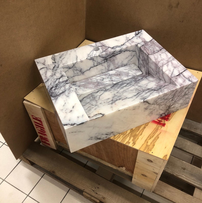 carrara-marble-sink-export-crate.jpg Finished Carrara marble basin protected inside a reinforced wooden export crate for international delivery.