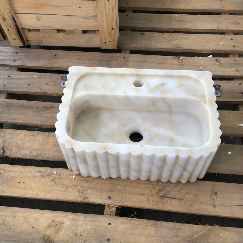 #HandCarvedSink #CalacattaViolaMarble #CustomizableVanityTop #CustomizableSink #BathroomSink #PowderRoomSink #FarmhouseSink #RareUniqueItem #WallMountSink #VesselSink #NaturalStoneSink #MarbleBathroomSink #LuxuryBathroomDecor #MarbleSinkCo