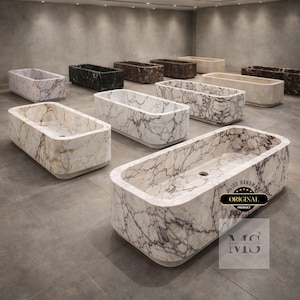 May include: A collection of rectangular marble bathtubs in various colors, including white, black, brown, and beige. The tubs have rounded edges and a smooth finish. Some tubs feature a swirling vein pattern. The image includes a logo that says "Original Product".