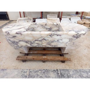 Suspended marble sink made from rare Calacatta Viola marble, floating vanity basin carved by master artisans, luxury architectural statement sink designed for high end bathrooms, sculptural stone sink suspended with ceiling chains creating a dramatic floating illusion, custom luxury marble sink perfect for designer interiors and iconic architectural spaces