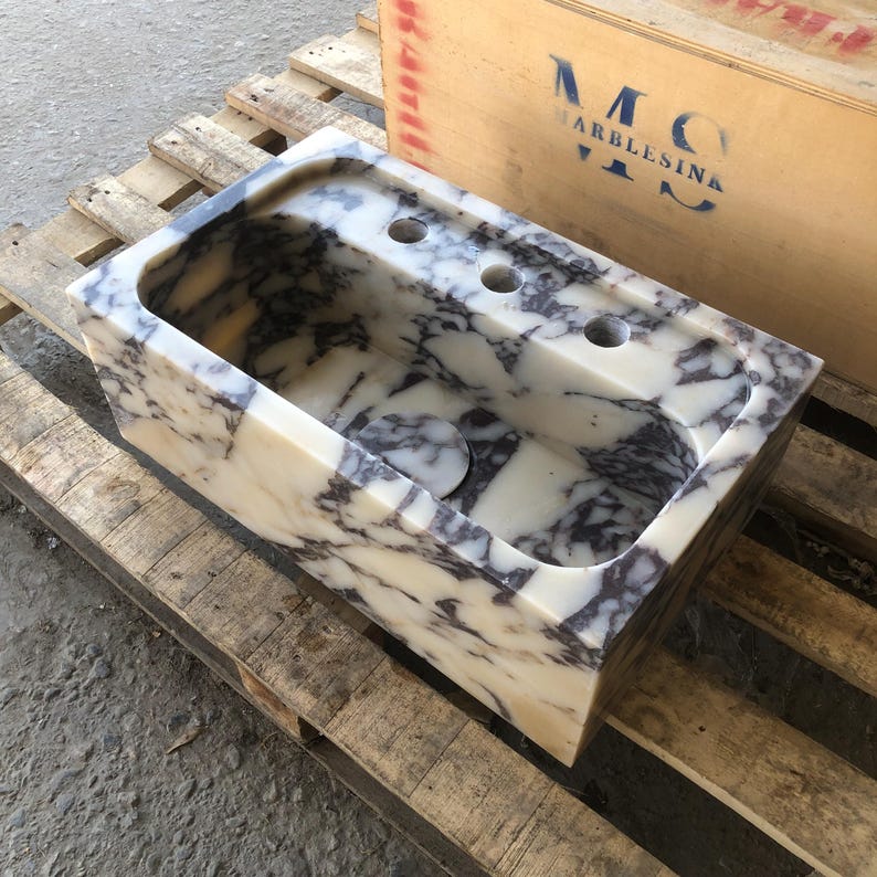 Finished Calacatta Viola marble sink with white stone and burgundy veining