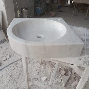 "Hand-carved Carrara marble sink – elegant, durable, and timeless. Perfect for luxury bathrooms, powder rooms, and boutique interiors. Custom sizes available: wall-mounted or countertop installation. Each piece features unique natural veining, adding character to your space. Discover our full collection of marble sinks, bathtubs, and stone accessories at MarbleSinkCo – follow us for more exclusive designs."