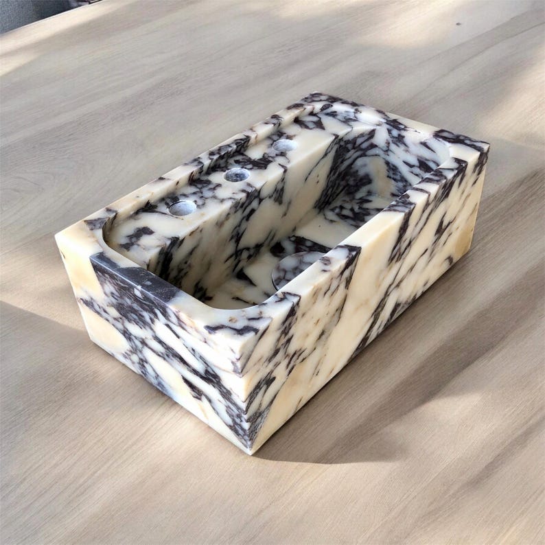 Custom faucet hole and installation options for the handmade marble sink