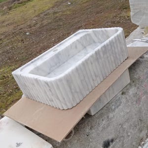 Luxury Carrara marble sink, wall mounted marble basin, floating bathroom sink, natural stone vanity, Italian marble washbasin, handcrafted marble sink, single block stone sink, modern luxury bathroom, designer vanity sink, premium stone basin, countertop vessel sink, custom size marble sink, spa style bathroom, boutique hotel bathroom, high end bathroom renovation