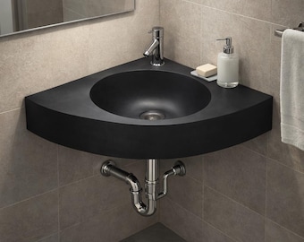 Lavabo esquinero de basalto negro: lavabo triangular de pared para interiores modernos y de lujo.