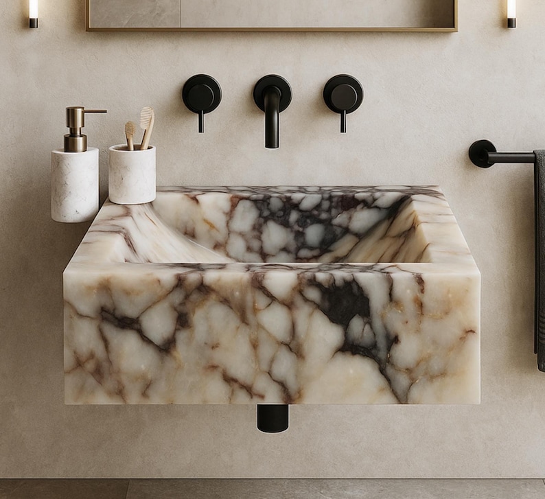 Calacatta Viola marble wall-mount sink with stunning natural veining. Handcrafted floating stone basin with no overflow, single faucet hole. Perfect for luxury bathrooms, interior designers, boutique hotels, and modern renovations. Ideal as a vessel sink, bar sink, or designer washbasin. Unique Italian marble sink for minimalist, high-end bathrooms. Trending marble bathroom decor, handcrafted stone sink.