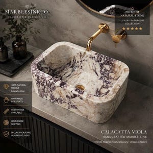 Luxury handcrafted Calacatta Viola marble floating wall mounted bathroom sink with fluted front in a premium designer bathroom.