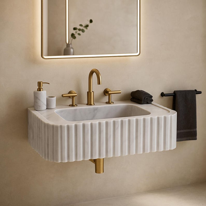 Hand carved white marble vessel sink with polished interior and chiseled exterior perfect for luxury bathroom or powder room vanity