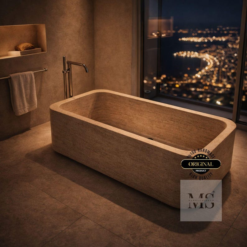 May include: A rectangular, light-colored stone bathtub with a modern design. The bathroom features a towel rack, a faucet, and a window overlooking a city at night. The image includes the text "ORIGINAL PRODUCT HIGH QUALITY".