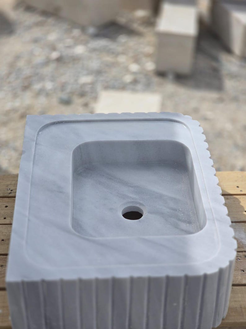 Marble bathroom sink packed in a protective wooden crate shipped with care via insured DHL Express worldwide delivery
