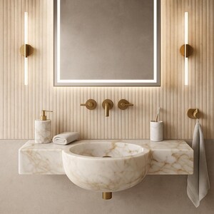 Luxurious wall-mounted Calacatta marble sink carved from a single block. Featuring 3 faucet holes, fluted front design, and floating vanity look. Ideal for modern, minimalist bathrooms. Custom sizes available. Handmade from natural Italian stone. Bathroom sink, marble vanity, stone basin, designer sink, fluted marble, wall mount sink, handmade sink, rectangular sink, luxury bathroom decor.