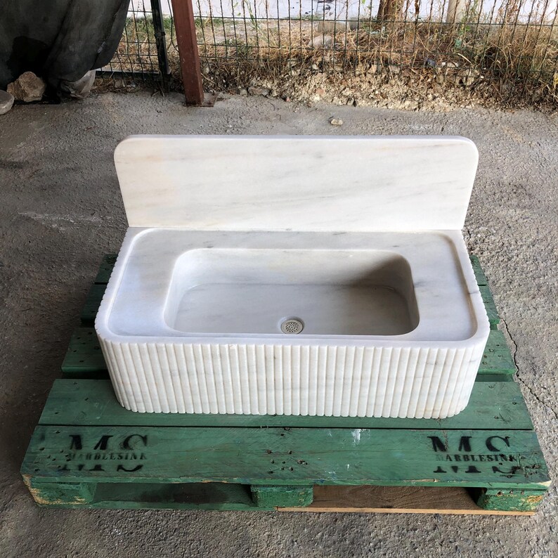 #marblesink #whitebathroom #bathroomdesign #vesselsink #stonevesselsink #interiordesign #interiordesigner #interiorstyling #bathroominspo #customsink #luxuryinterior #bathroomrenovation #naturalstone #vanitydesign #interiorproject #architecturaldetails #moderninterior #marbledesign #bathroomvanity #wallmountsink #designobsessed #bathroomgoals #luxurybathroom #homedecortrends #interiorgoals #minimalistdesign #sculpturaldecor #bathroomtrends2025 #naturalstonesink #etsyfinds