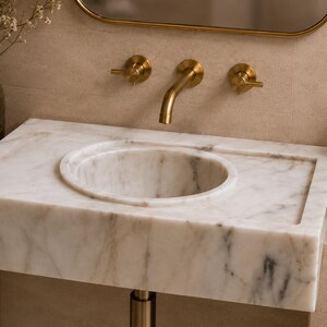 marble-sink-dhl-wooden-crate-packaging.jpg MarbleSinkCo Calacatta Gold marble sink shown as a luxury statement piece with brand styling, polished natural stone texture and premium bathroom design