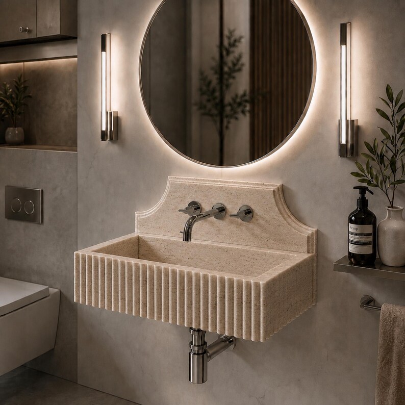 Luxury handcrafted Calacatta Viola marble floating wall mounted bathroom sink with sculptural fluted front and architectural backsplash in a premium designer bathroom.