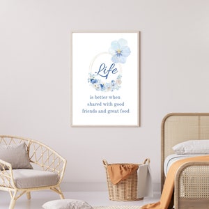 May include: A watercolour print featuring blue flowers and the text "Life is better when shared with good friends and great food".