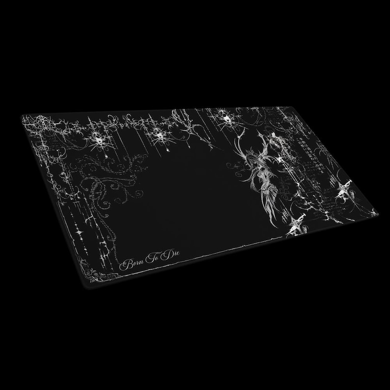 May include: Black rectangular mousepad with a white gothic design. The design includes ornate floral patterns, abstract lines, and the text "Born To Die". The mousepad has a dark, edgy aesthetic.