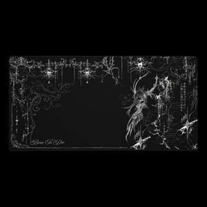 May include: Black rectangular desk mat with a white gothic-style design. The design includes ornate floral patterns, a central figure, and the text "Born To Die". Japanese text is also present.