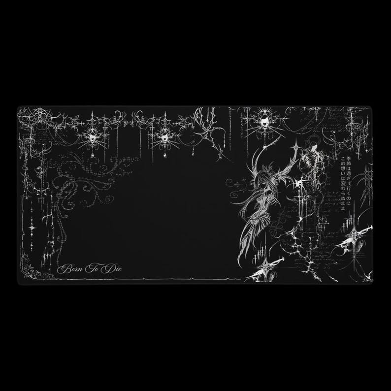 May include: Black rectangular desk mat with a white gothic-style design. The design includes ornate floral patterns, a central figure, and the text "Born To Die". Japanese text is also present.