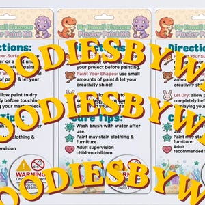 May include: Three identical My Kawaii Dinosaur Plaster Paint Kit packaging cards featuring instructions and care tips. The cards display cartoon dinosaur illustrations, text headers, and a circular warning symbol for choking hazards for children under three.