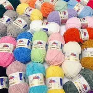 May include: A variety of colorful yarn skeins, all labeled "Himalaya Dolphin Baby". The yarn is soft and fluffy, perfect for knitting or crocheting baby items.