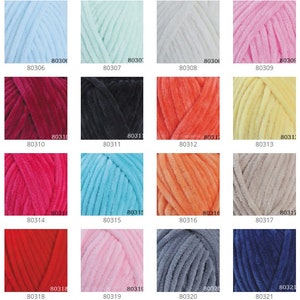 May include: A chart of 25 different colors of yarn, each color is labeled with a number. The yarn is a soft, fuzzy texture.