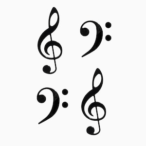 May include: Four black musical symbols on a white background. Two treble clefs and two bass clefs are displayed. The treble clefs have a curved, looping design, while the bass clefs have a rounded shape with two dots.