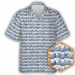 May include: A blue and white short-sleeved button-up shirt with a repeating pattern of stylized mountains. The mountains are blue and white with red accents. The shirt has a collar and a button-up front.