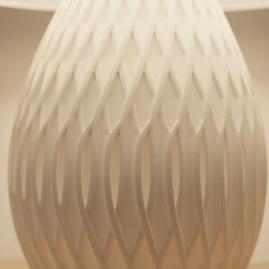 May include: A set of three ceramic mugs with a speckled, matte finish. The mugs are in shades of cream, light brown, and dark brown. Each mug has a simple, minimalist design, perfect for coffee or tea.