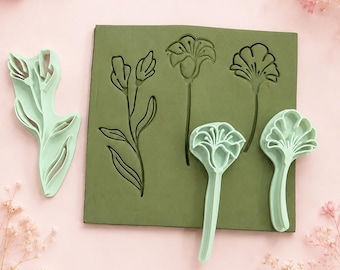 Stempels van klei met afbeeldingen van lisianthus, iris en ginkgo | Gereedschap voor botanisch pottenbakken