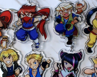 May include: Set of 10 colorful anime character keychains. Each keychain features a different character with unique designs and poses. The keychains are made of clear acrylic and have silver metal key rings.