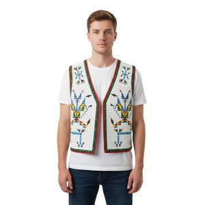 May include: A white sleeveless vest featuring a geometric pattern in blue, yellow, and green. The vest has a V-neckline, a red and green border trim, and a quilted texture. It is worn over a plain white t-shirt and dark blue denim jeans.