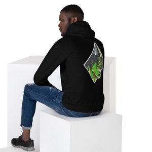May include: Black hooded sweatshirt with a green and yellow graphic of a monster's face on the back.