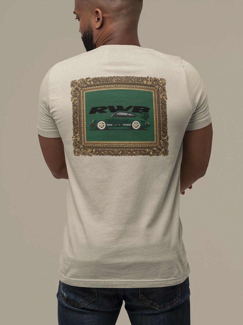 May include: Beige t-shirt with a framed graphic on the back. The graphic features a green sports car with the text "RWB" in black. The car is set against a green background within a gold ornate frame.