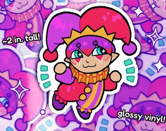 Puede incluir: Una pegatina colorida con un bufón de dibujos animados con un sombrero y un atuendo rojos y morados. La pegatina mide aproximadamente 5 cm de alto y está hecha de vinilo brillante. El bufón tiene una corona dorada y una cara sonriente con ojos azules.