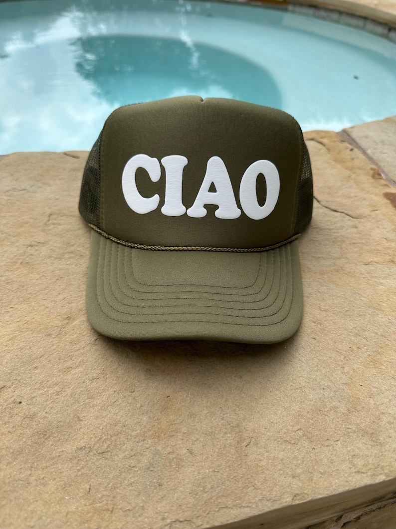 May include: A green trucker hat with a white "CIAO" logo in a retro font.