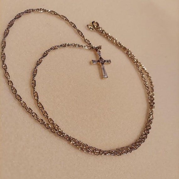 Pendant necklace has cross that is gold tone with… - image 1