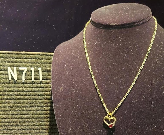 Gold tone pendant necklace has heart shaped penda… - image 1