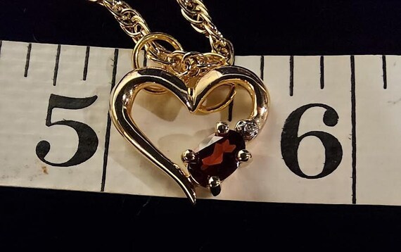 Gold tone pendant necklace has heart shaped penda… - image 7