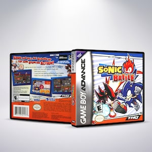 May include: Game Boy Advance game cartridge case for Sonic Battle. The front of the case features a red, blue, and black illustration of Sonic the Hedgehog and Shadow the Hedgehog fighting. The back of the case features a description of the game and a rating of E for Everyone.