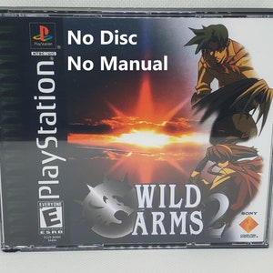 May include: PlayStation game case for Wild Arms 2. The case is black with a red, orange, and yellow sunset background. The game title is in white text with a black wolf logo. The ESRB rating is Everyone. The text "No Disc No Manual" is written in black text on the top of the case.