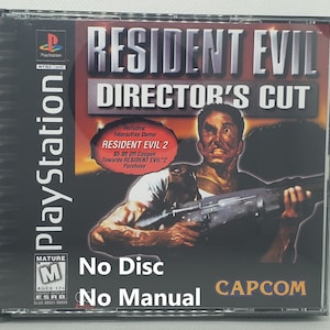 May include: A PlayStation game case for Resident Evil: Director's Cut. The cover features a man holding a gun, with the game title in large letters. Includes a coupon for Resident Evil 2. The case is marked "No Disc" and "No Manual."
