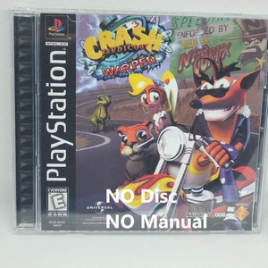 May include: A PlayStation game case for Crash Bandicoot: Warped. The cover art features Crash Bandicoot riding a motorcycle, with other characters and the game title. The case is clear plastic with the PlayStation logo.