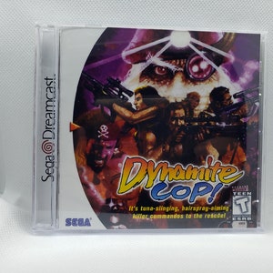 May include: A Sega Dreamcast game case with a colorful image of a video game character with a pirate hat and eye patch. The game title is "Dynamite Cop!" and the ESRB rating is "Teen".