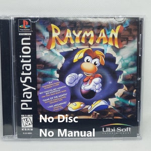 May include: A PlayStation game case for "Rayman." The cover art features the Rayman character against a blue and white background. The case is clear plastic with the PlayStation logo on the spine. The text "No Disc" and "No Manual" are visible.