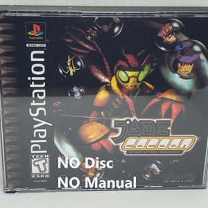 May include: A PlayStation game case for Jade Cocoon: Story of the Tamamayu. The case is black with a clear plastic front. The front of the case features a colorful image of a bug-like creature with large green eyes. The text "Jade Cocoon: Story of the Tamamayu" is printed in white on the case. The ESRB rating of "Teen" is visible in the lower left corner. The text "No Disc" and "No Manual" is printed in white on the case.